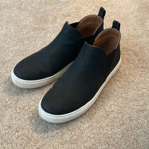 Black slip-on sneakers